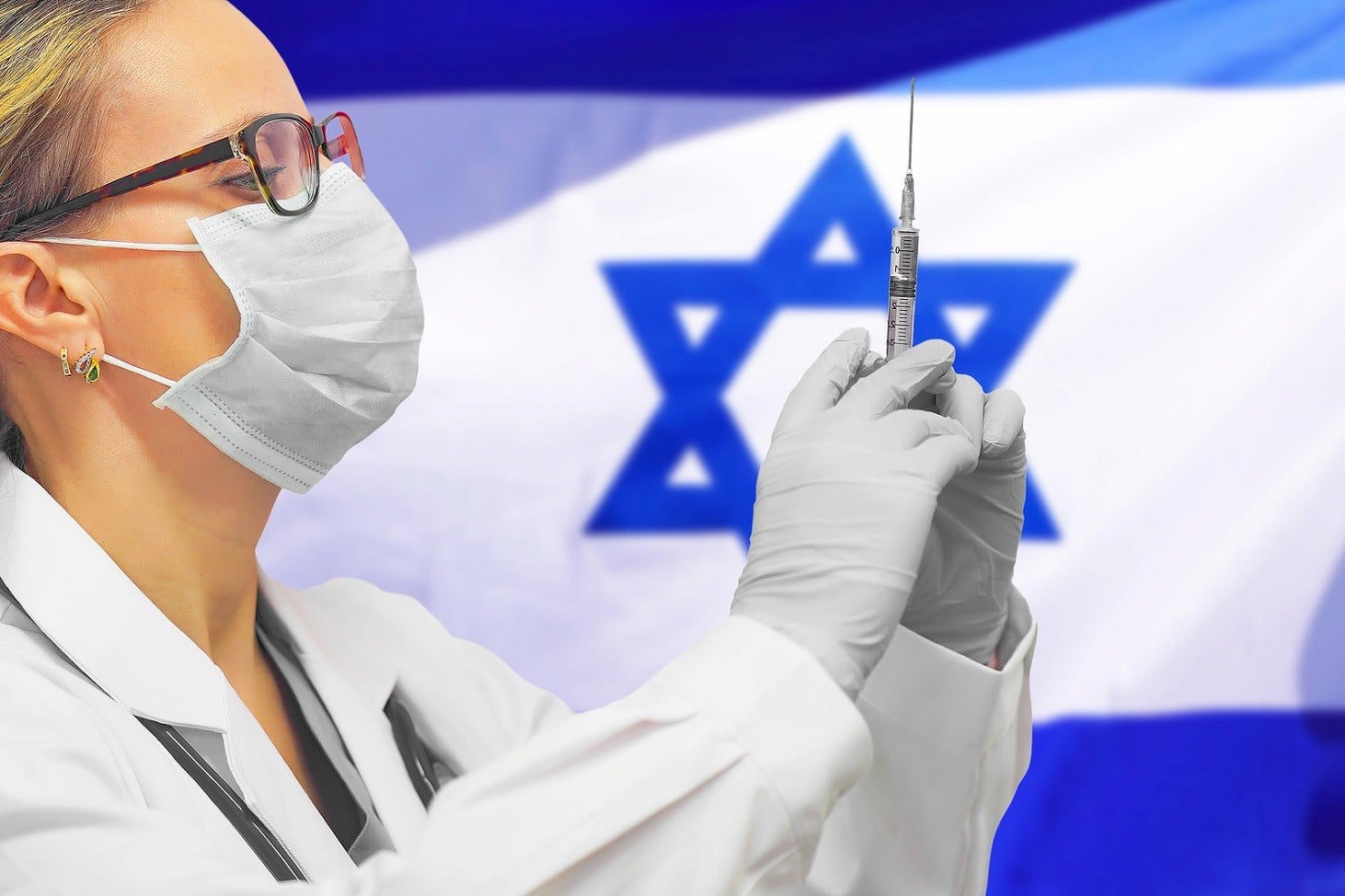 Female Doctor Or Nurse In Gloves Holding Syringe For Vaccination