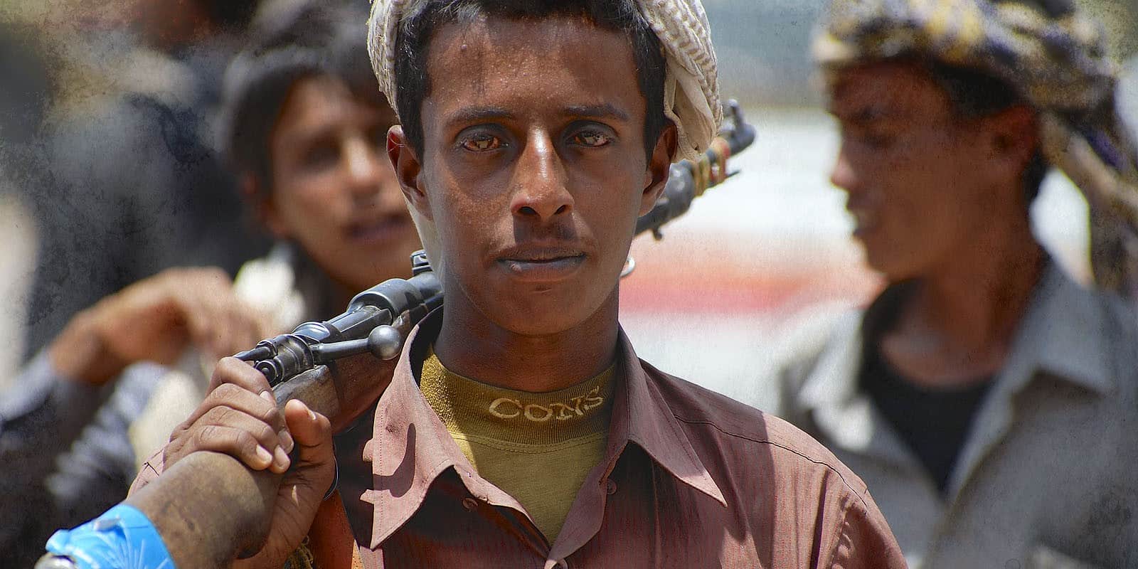 Unidentified young Yemeni man holds a rifle in Aden, Yemen.
