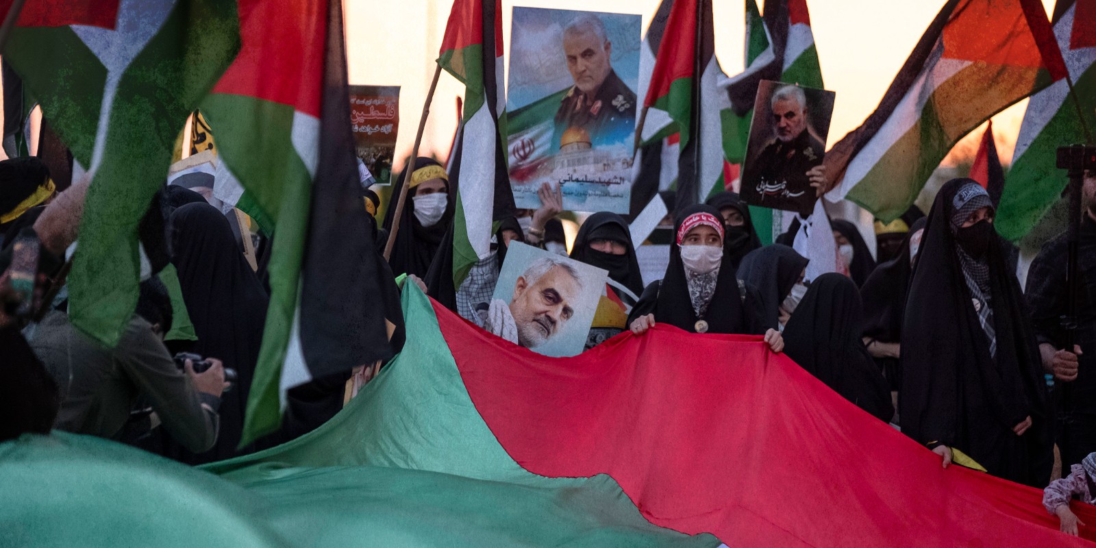 Pro-Palestinian Protests In Iran Iranian clergywomen hold a giant Palestinian flag and portraits of the Iranian former Islamic Revolutionary Guard Corps (IRGC) Quds Force General Qasem Soleimani