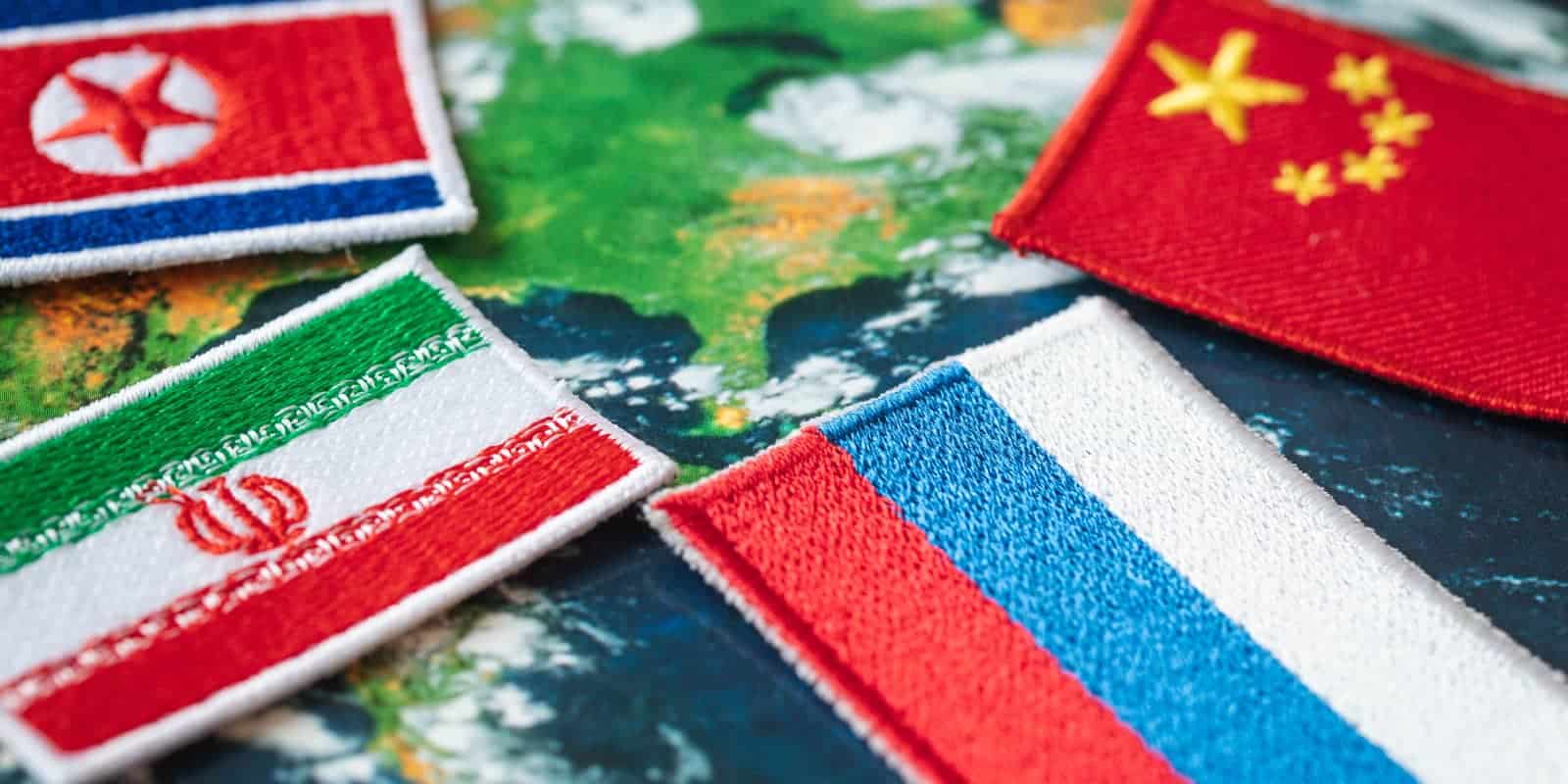 Symbols of Russia, China, North Korea and Iran against the background of the world, the concept of alliance and cooperation between countries
