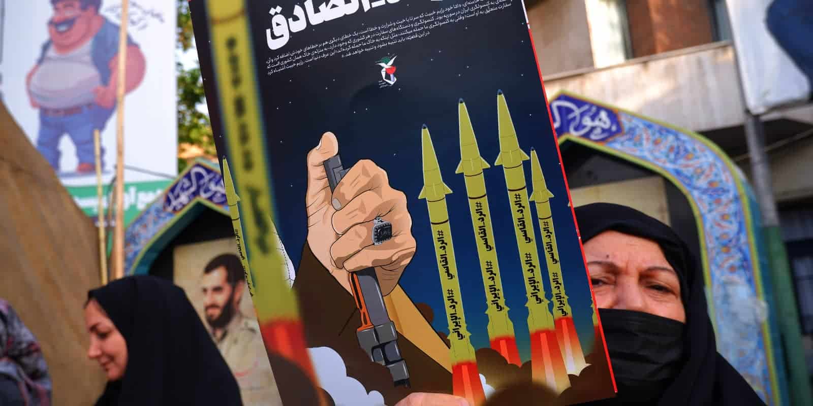 April 14, 2024, Tehran, Iran: An Iranian pro-government supporter woman holds an anti-Israel poster o