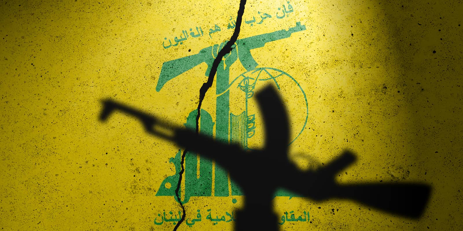 Flag of terrorist organization Hezbollah painted on the concrete wall. Gaza and Israel war. Terrorist organization Hezbollah
