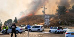 Fire and smoke are seen following rocket attacks from Lebanon, in Rosh Pina, northern Israel, on Oct. 20, 2024
